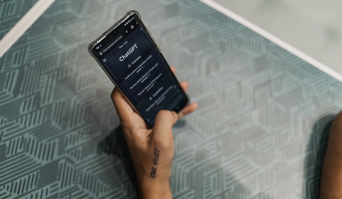Person using AI chatbot on phone - testing best AI apps for iPhone