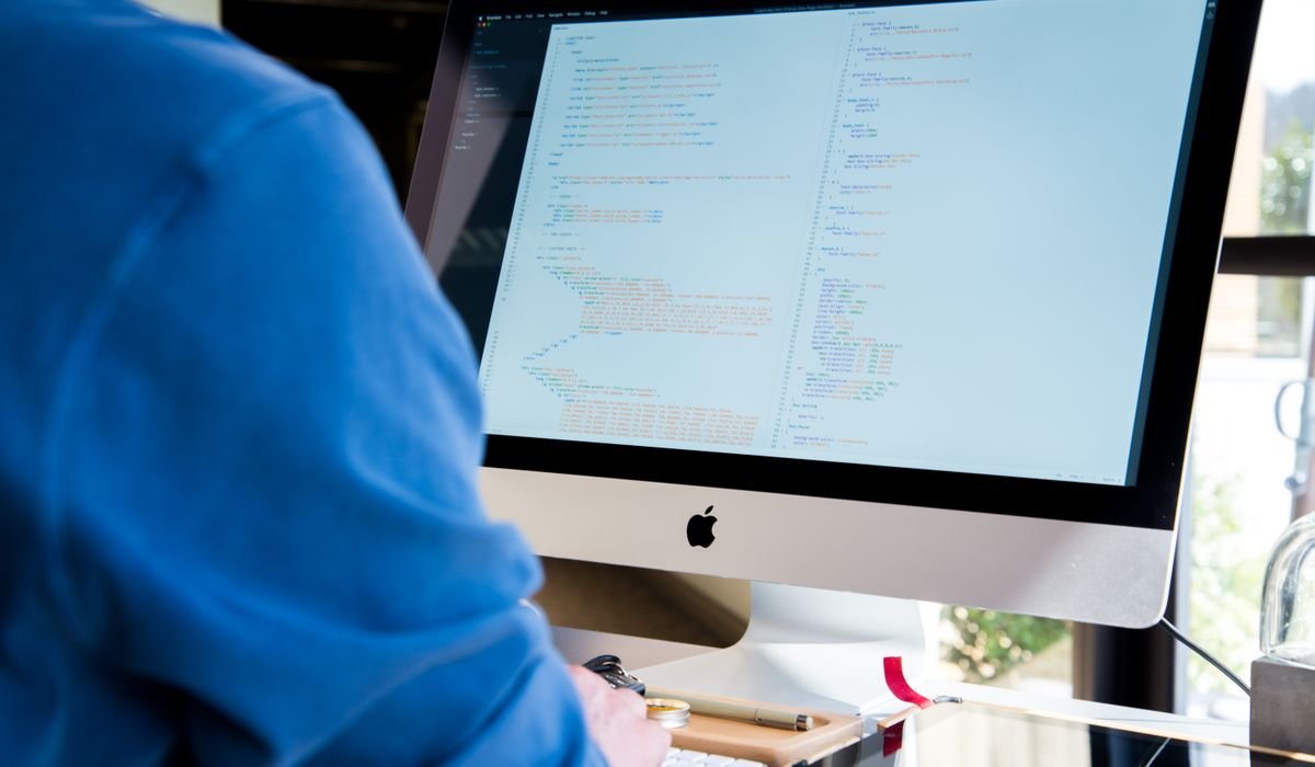 Developer coding on multiple screens - best AI coding assistants 2026
