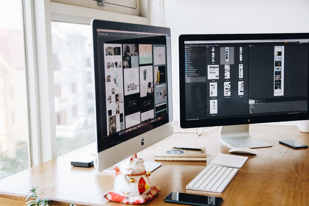 Camera and laptop on desk for photo editing setup