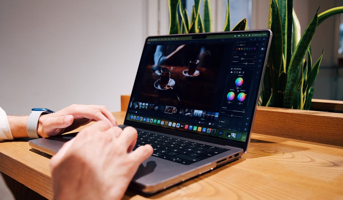 Person editing video on laptop - testing best free video editors