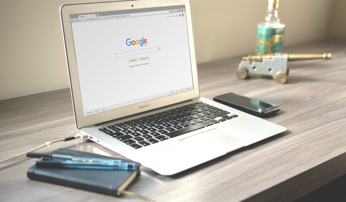 Laptop screen with Google Docs document open - how to delete a page in Google Docs
