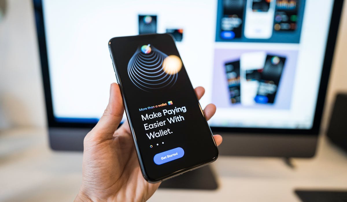 Person using smartphone with payment app - how to delete Cash App account guide