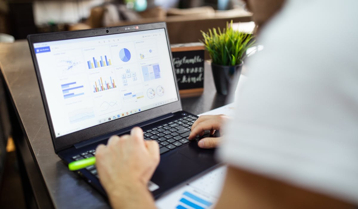 Laptop showing Excel spreadsheet - how to enable macros in Excel tutorial