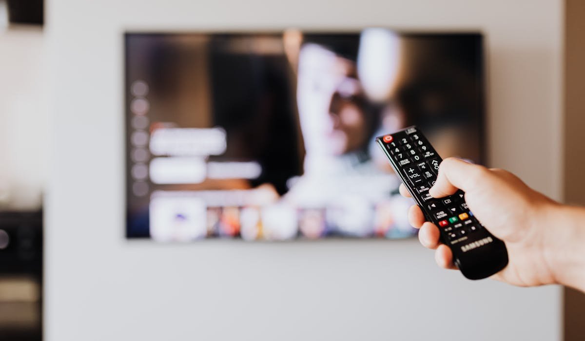 TV with streaming app on screen - how to set up Firestick guide