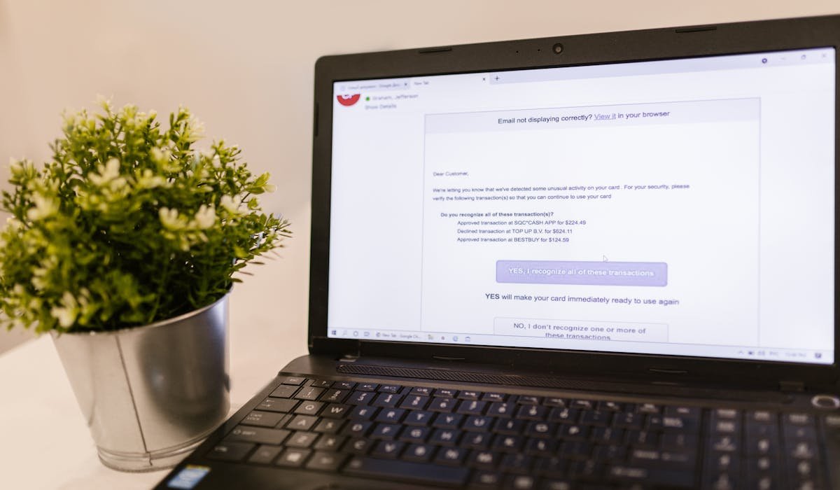 Laptop showing Gmail inbox with spam folder - how to stop spam emails on Gmail